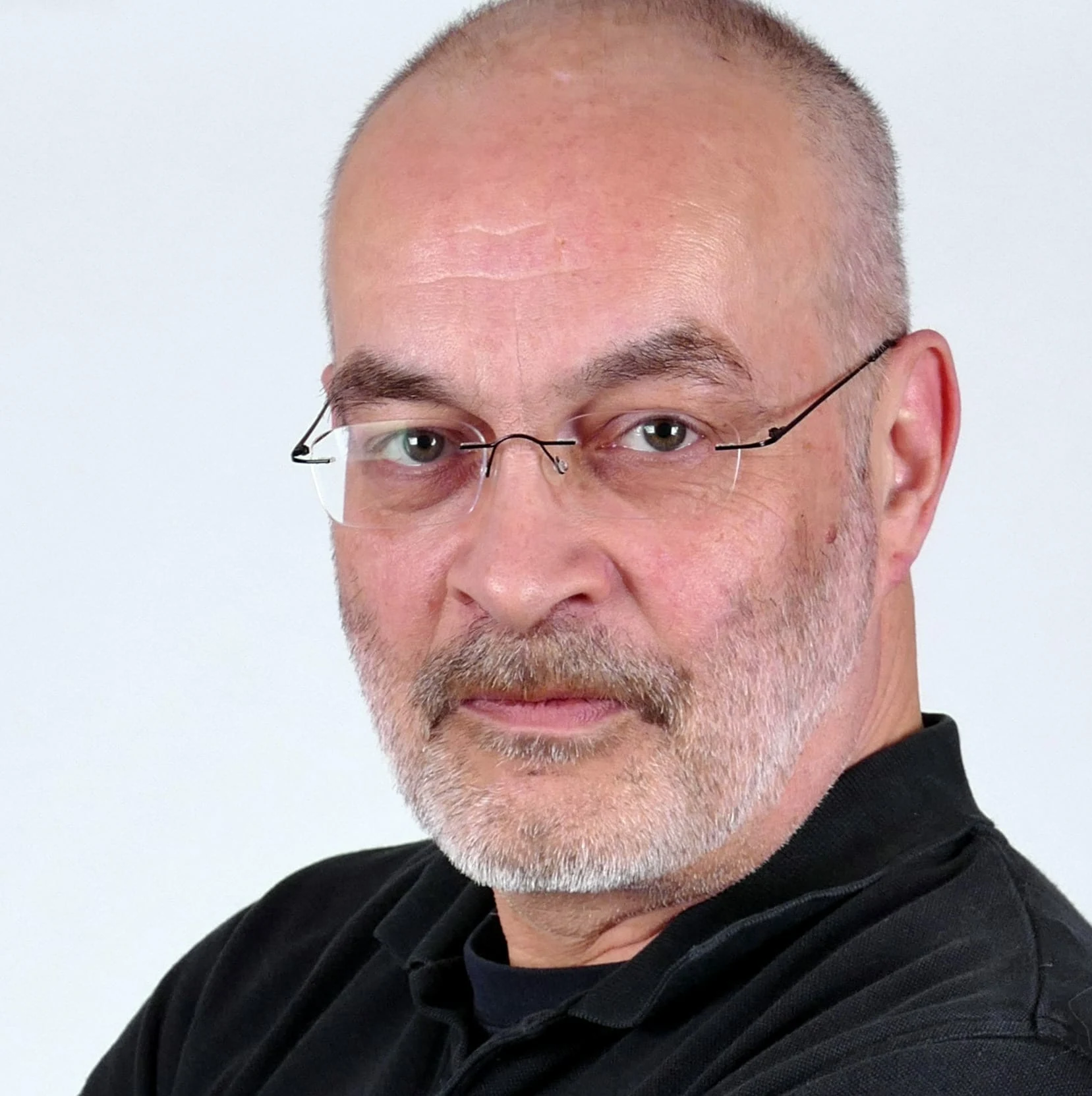 Middle-aged man, expert in cannabis lighting technology, with LED grow lights.