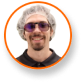 Alex Gonzalez in hair net and glasses, smiling, expert in cannabis lighting technology.