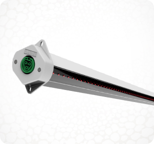 Close-up of LED grow light for cannabis with green connector, white backdrop.