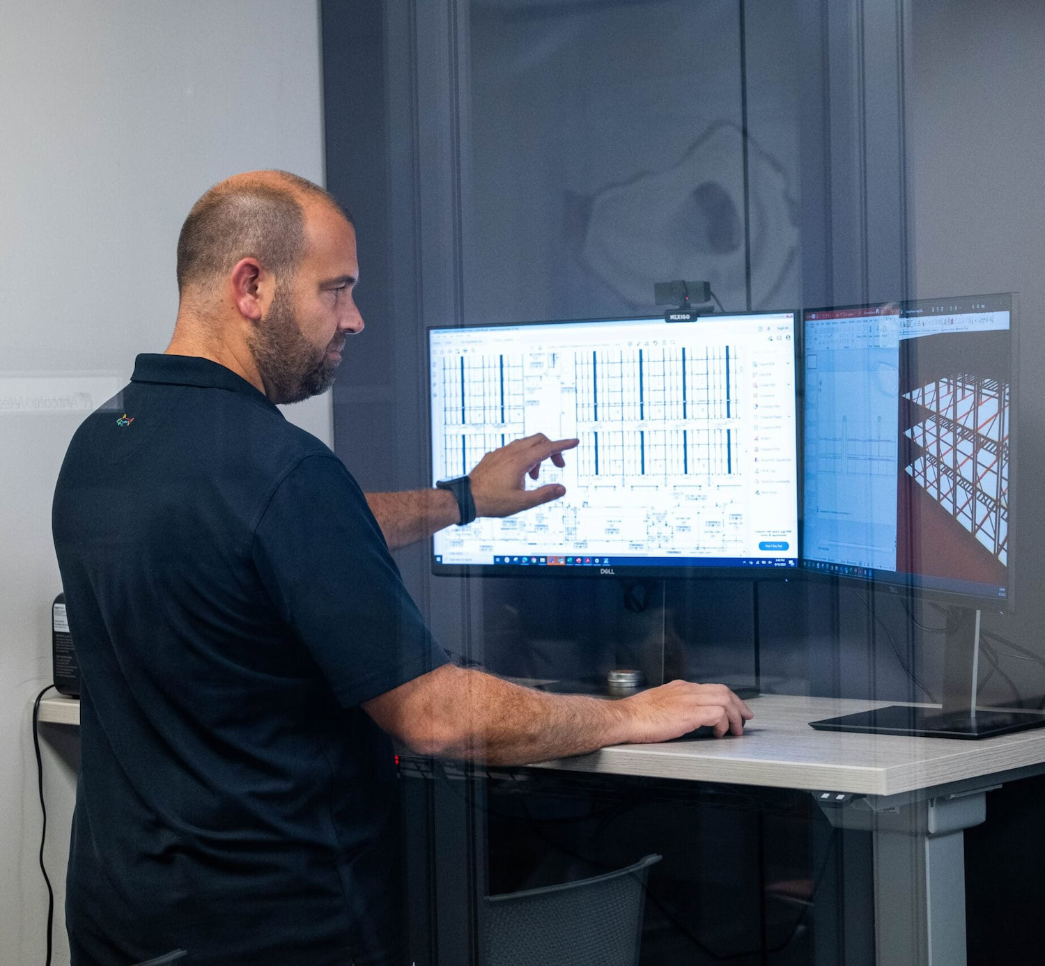 Man reviews cannabis lighting diagrams for commercial cannabis cultivation support.