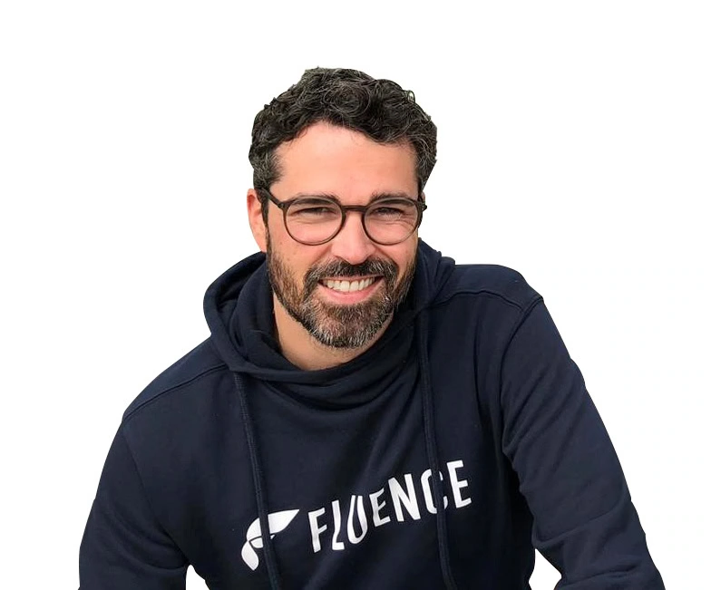 A man in a "FLUENCE" hoodie, expert in LED grow lights for cannabis cultivation.