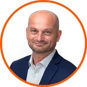 Smiling man in blazer, cannabis lighting expert, LED grow lights for cannabis.