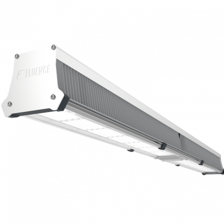 Silver Fluence LED grow light for commercial cannabis cultivation, low angle view.